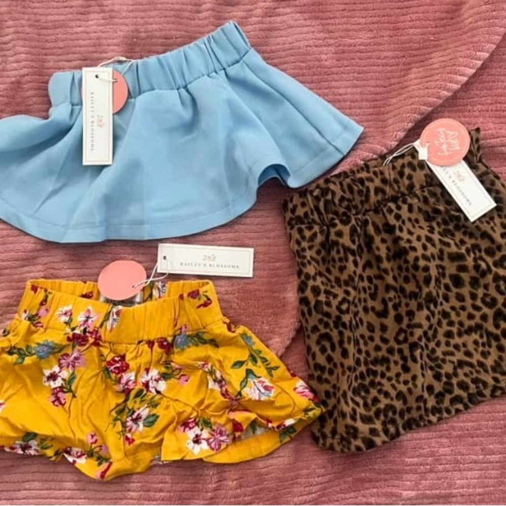 Blue, Yellow Floral, and Leopard Print Skirts (0/3 months) (NWT)